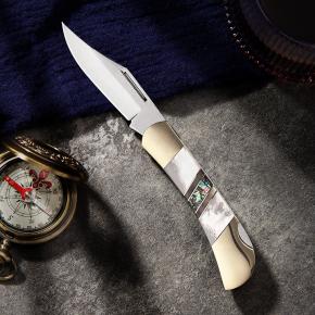 folding knife with white shell handle 